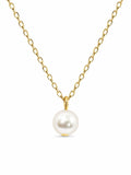 Gold tone chain necklace with a single pearl pendant, stylish fashion jewelry by Republic Mercantile.