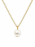 Gold tone chain necklace with a single pearl pendant, stylish fashion jewelry by Republic Mercantile.