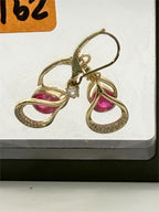 Pink teardrop gemstone earrings with 14k gold-plated hooks from Republic Mercantile, showcasing elegant jewelry design.