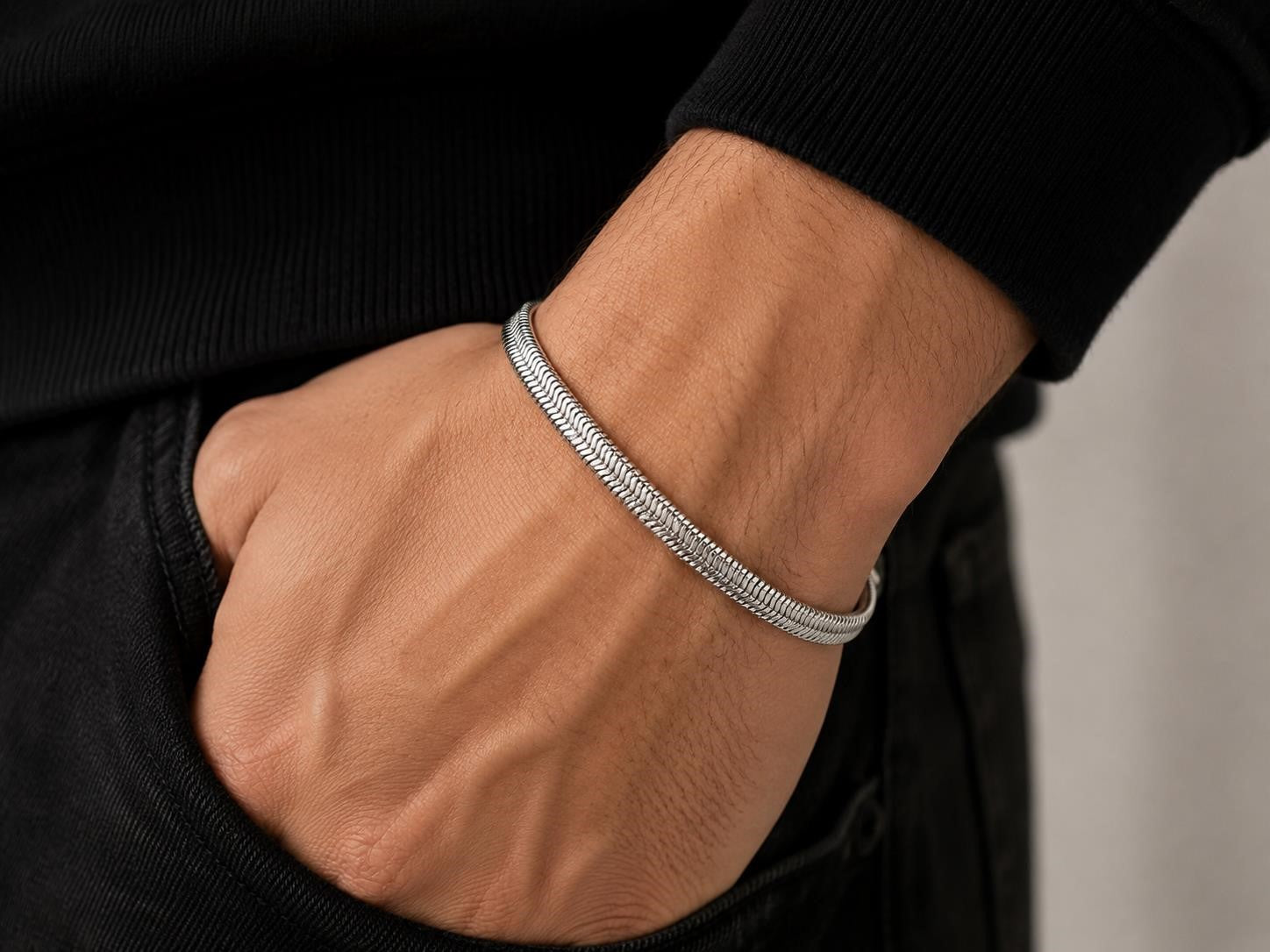 Men's silver toned herringbone chain bracelet with a sleek, polished finish, designed by Republic Mercantile.