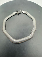 Men's silver-toned herringbone chain bracelet from Republic Mercantile, featuring a sleek, woven jewelry design.