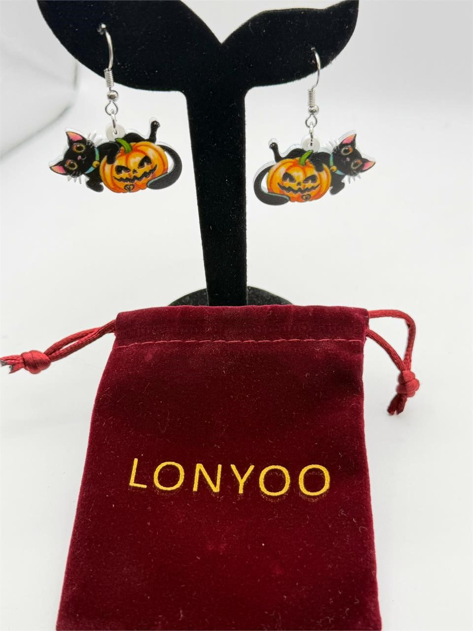 Lonyoo Halloween pumpkin and black cat earrings featuring orange pumpkins and black cats on silver hooks.