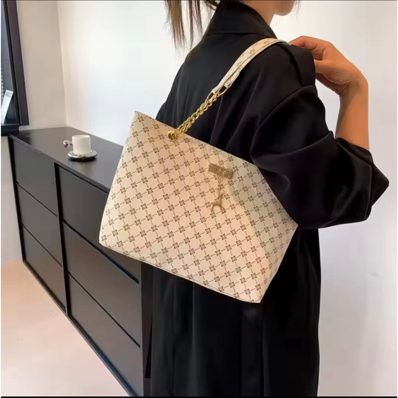 Sandglass Women's casual shoulder tote bag in white with gold accents, featuring a spacious design and stylish look.