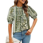 Prettygarden women's green floral short-sleeve blouse with a relaxed fit, featuring a feminine floral print and V-neck design.