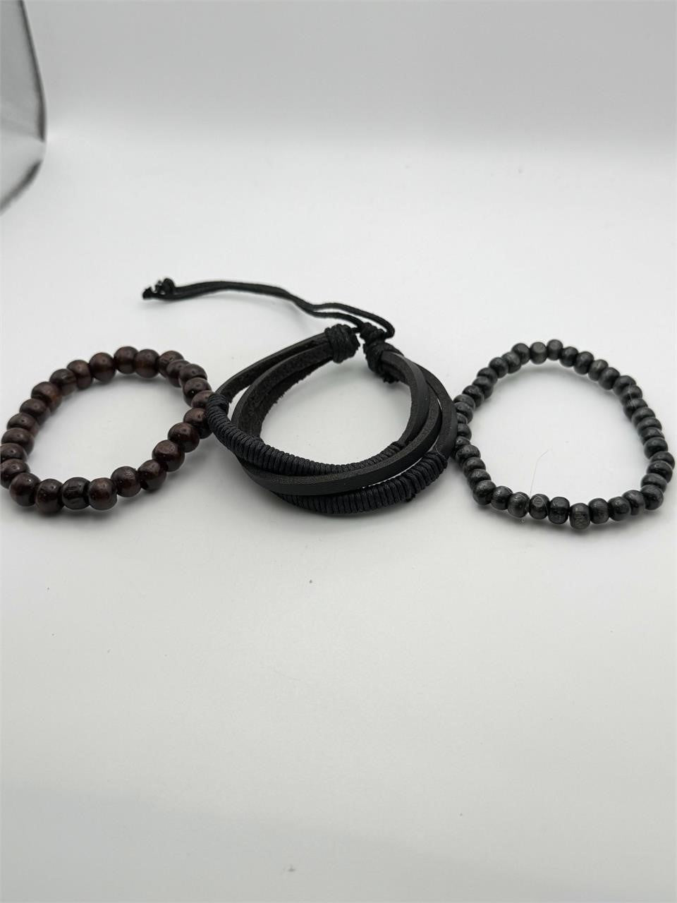 Handcrafted three-strand leather and bead bracelet by Republic Mercantile featuring natural leather and colorful beads.