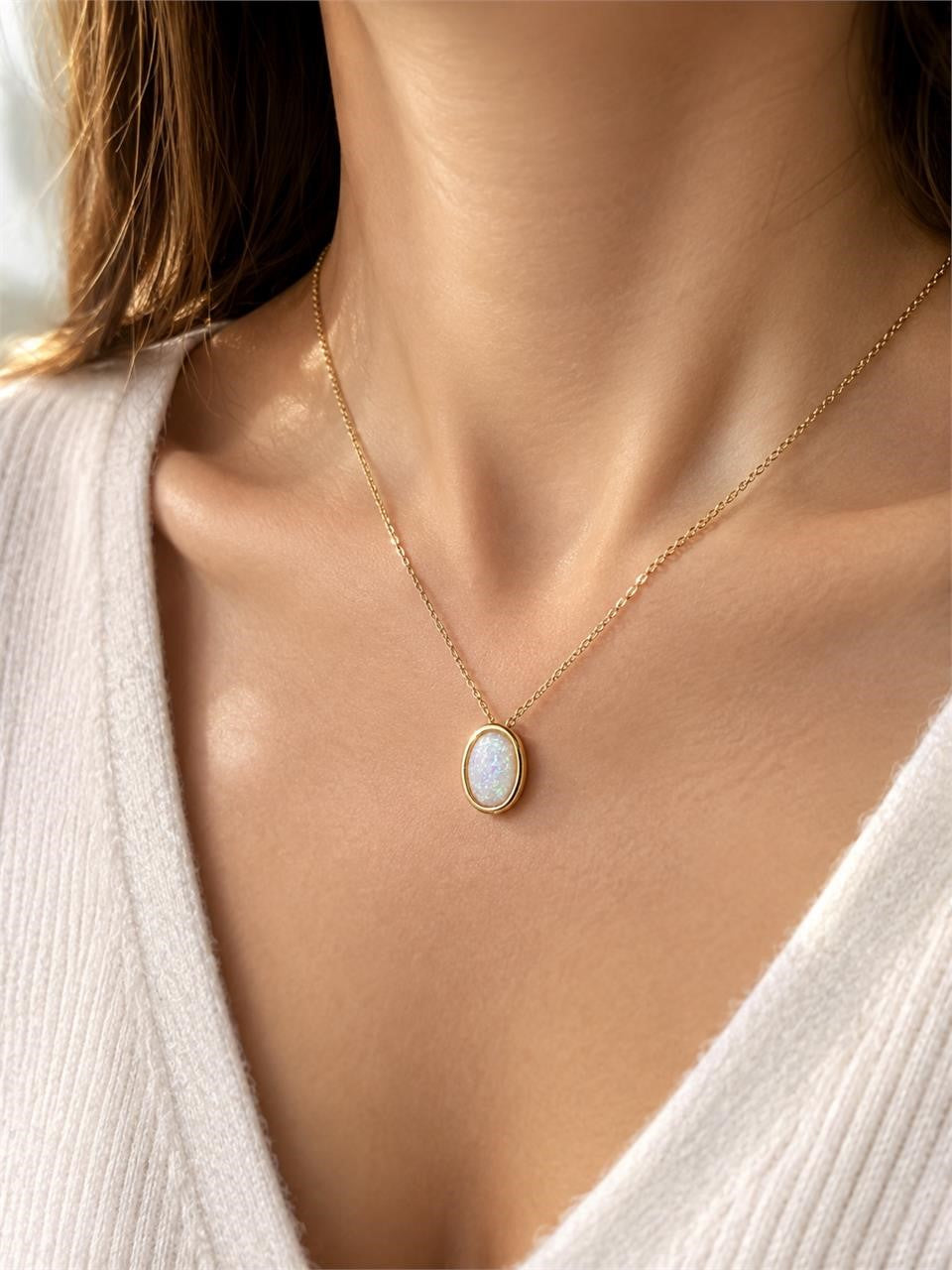 Iridescent opal-style oval pendant necklace from Republic Mercantile featuring a shimmering, colorful gemstone on a silver chain.