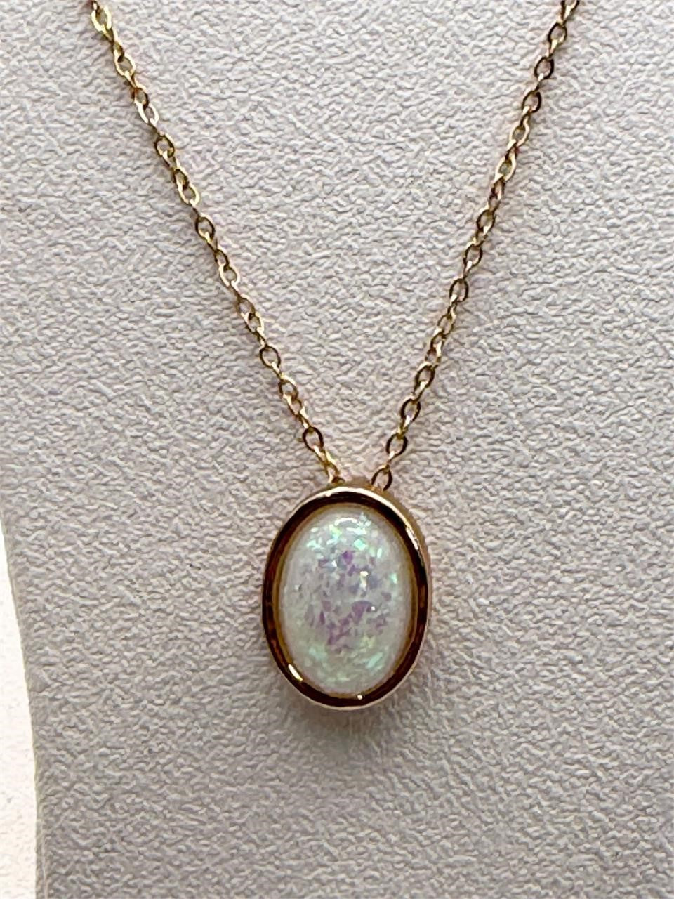 Iridescent opal-style oval pendant necklace with silver chain from Republic Mercantile, showcasing a shimmering, colorful gemstone.