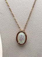 Iridescent opal-style oval pendant necklace with silver chain from Republic Mercantile, showcasing a shimmering, colorful gemstone.