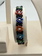 Peruvian beaded floral elastic bracelet by Republic Mercantile featuring colorful bead and floral design.