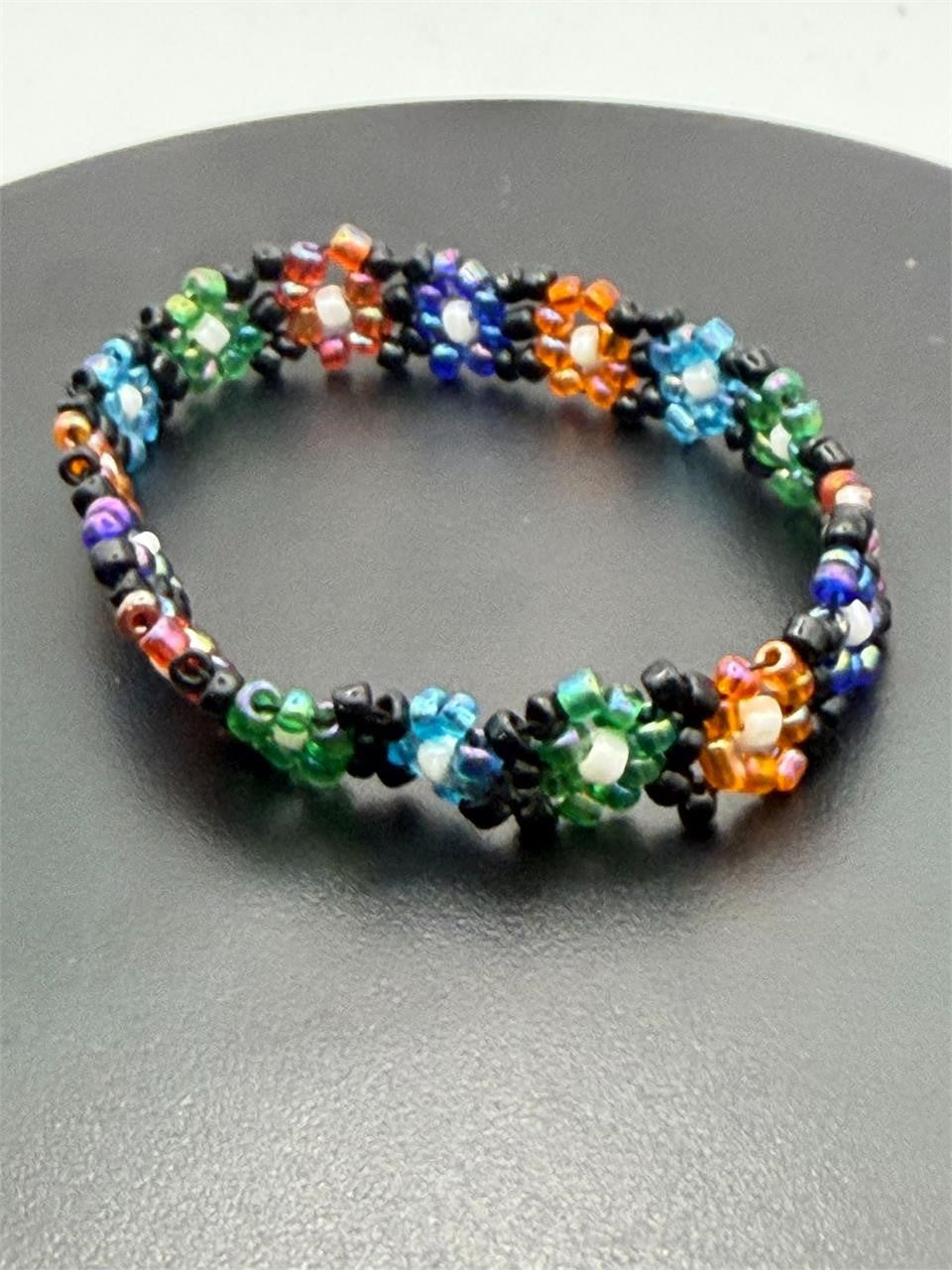 Peruvian beaded elastic floral bracelet with colorful beads and intricate floral design, handcrafted by Republic Mercantile.