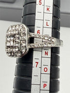 Sterling silver ladies CZ dinner ring in size 6.25 with intricate design and sparkling cubic zirconia accents.