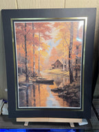 12x16 inch canvas art print of a cabin, displayed with a 16x20 black mat in a Republic Mercantile portfolio.