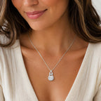 Elegant moissanite pendant necklace from Republic Mercantile with a sparkling gemstone on a delicate chain.
