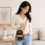 Brown Aohao heart-shaped crossbody faux leather backpack with zipper closure, featuring a stylish heart design and adjustable strap.