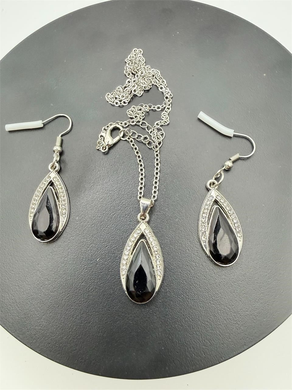 Black Onyx teardrop necklace and earrings set with silver accents, featuring elegant jewelry by Republic Mercantile.