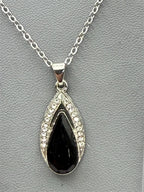 Black onyx teardrop necklace and earrings set featuring polished black stones with silver-toned findings, stylish jewelry by Republic Mercantile.
