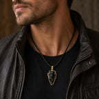 Black arrowhead pendant necklace with gold tone finish, featuring Republic Mercantile jewelry design on a chain.