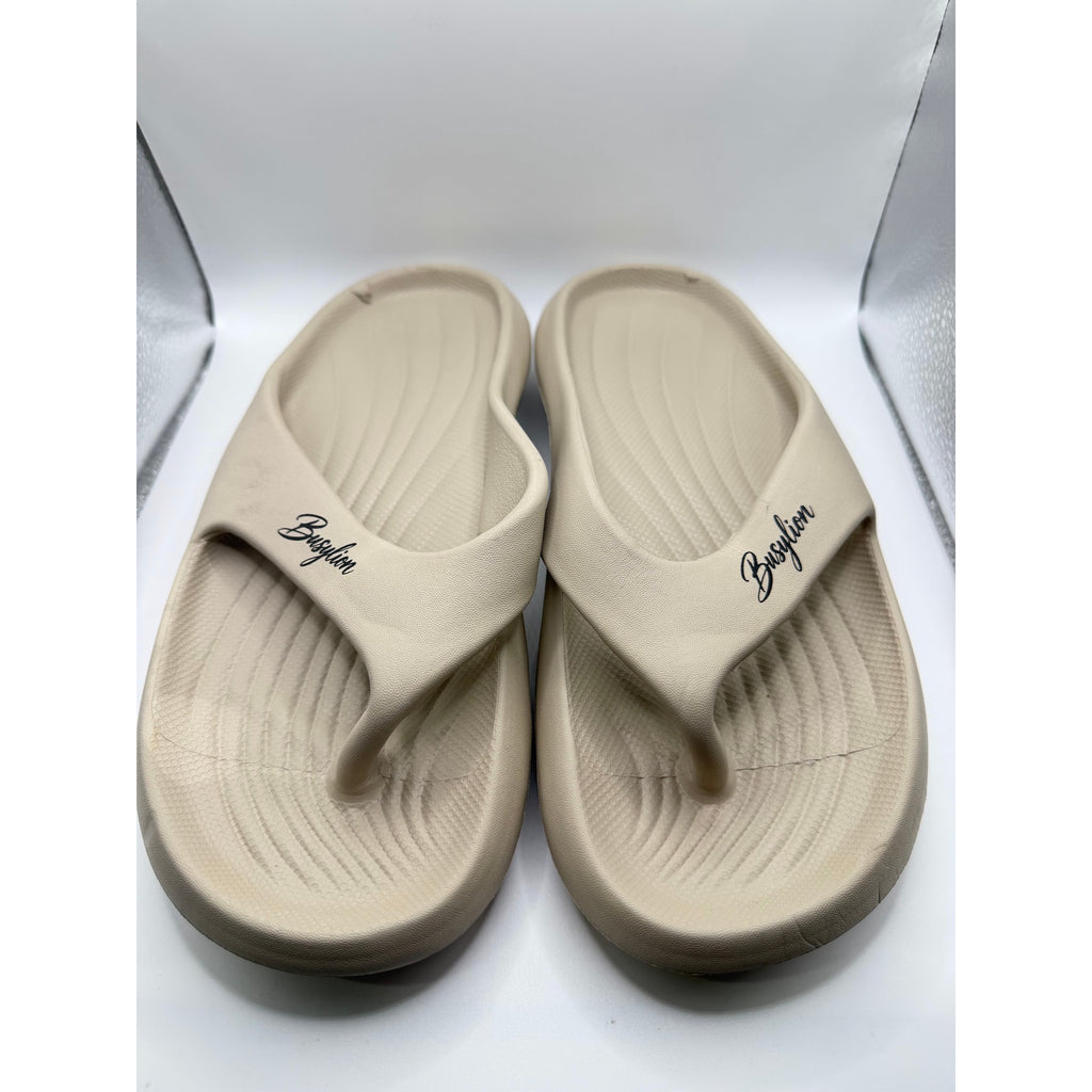 Busylion beige slip-on unisex slides in size 9.5 men's, featuring a comfortable open-toe design and casual style.
