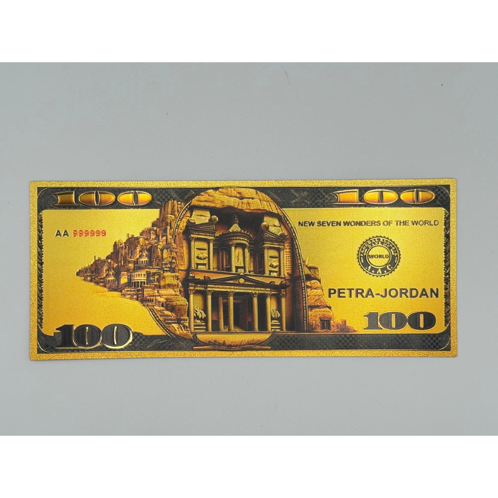 Set of seven gold foiled novelty notes featuring the 7 Wonders of the World by Republic Mercantile, displayed in a neat arrangement.