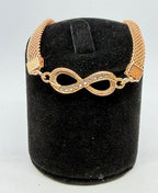 Rose gold figure 8 bracelet with sparkling CZ stones from Republic Mercantile, close-up view of the elegant jewelry piece.