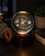 Etched crystal ball with LED lighting on a rotating stand, crafted by Republic Mercantile, showcasing intricate designs and vibrant illumination.