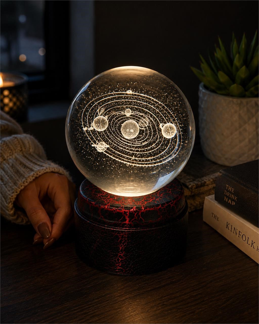 Etched crystal ball with LED lighting on a rotating stand, crafted by Republic Mercantile, showcasing intricate designs and vibrant illumination.