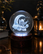 Etched crystal ball with LED lighting on a rotating stand, decorative display piece by Republic Mercantile.