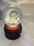 Etched crystal ball with LED lighting and rotating stand, decorative art piece by Republic Mercantile.