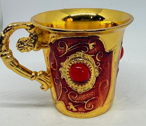 Red enamel jeweled brass cup with red stones, decorative Republic Mercantile drinkware featuring intricate details and vibrant colors.