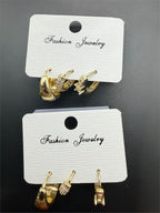 Three pairs of gold-plated earrings from Republic Mercantile, featuring stylish designs in a set for versatile fashion.