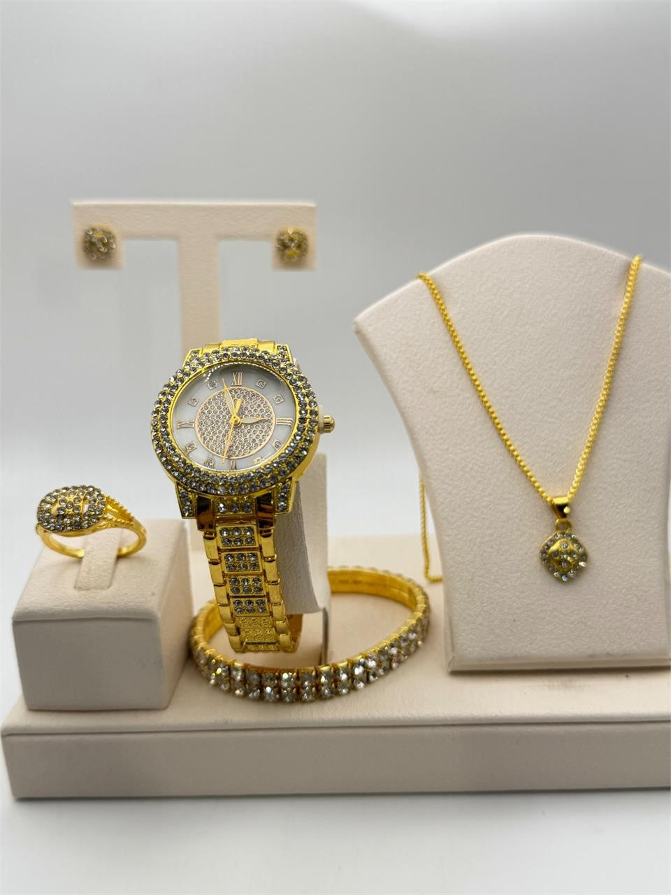 Gold-tone matching jewelry set including watch, bracelet, ring, necklace, and earrings from Republic Mercantile.