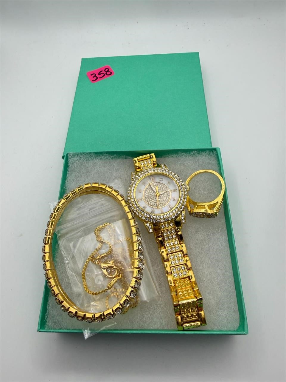 Gold tone 6-piece jewelry set including matching watch, bracelet, ring, necklace, and earrings by Republic Mercantile.