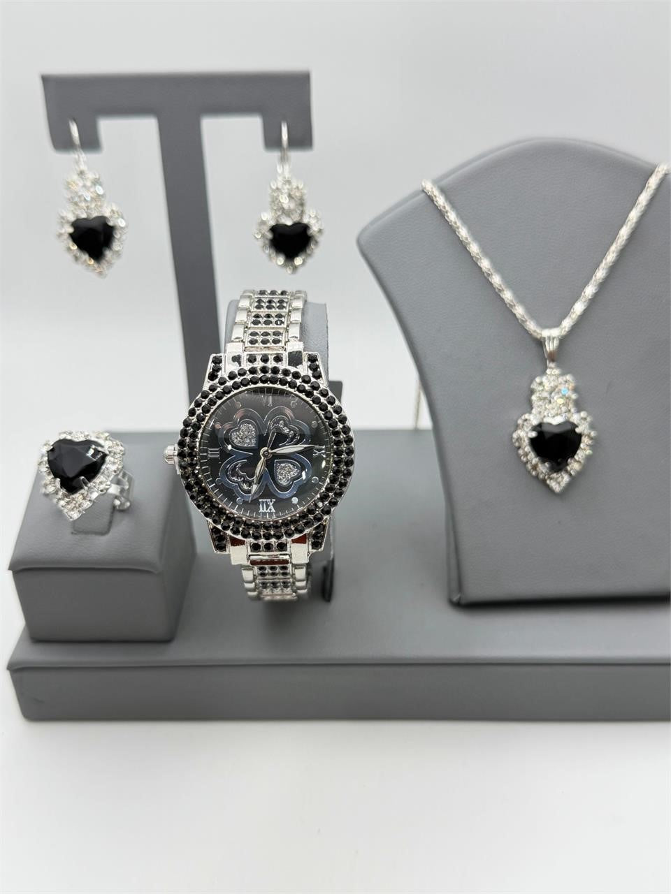 Matching jewelry set including watch, ring, necklace, and earrings from Republic Mercantile, featuring coordinated designs.
