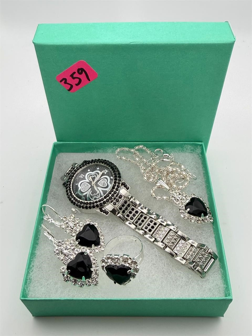 Matching jewelry set including watch, ring, necklace, and earrings in a 5-piece collection by Republic Mercantile, displayed together.