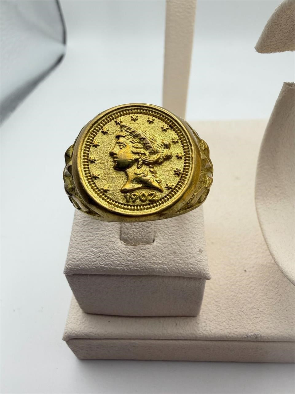 Men's gold tone ring featuring a 1902 coin design, size 11, by Republic Mercantile, showcasing the detailed coin and band.