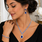 Four-piece fashion jewelry set with sapphire and diamond accents from Republic Mercantile, featuring elegant necklace, earrings, and bracelet.