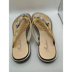 Bejeweled women's gold sandals with bling accents, size US 9-9.5, featuring stylish straps and sparkling embellishments.