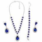 Four-piece fashion jewelry set with sapphires and diamonds from Republic Mercantile, featuring elegant necklaces and earrings.