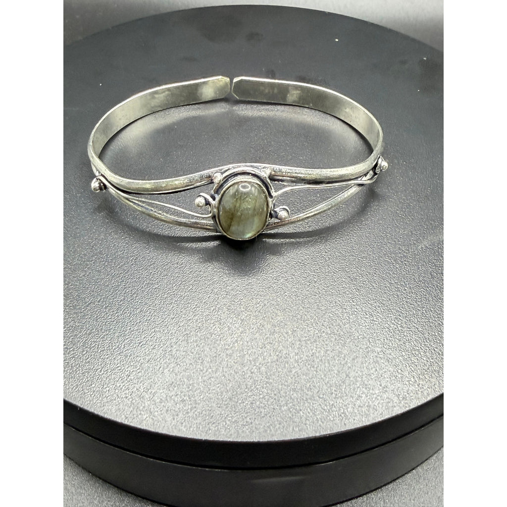 Silver plated bangle gem bracelet with handcrafted design from Republic Mercantile, featuring decorative gemstones and intricate detailing.