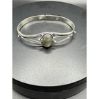 Silver plated bangle gem bracelet with handcrafted design from Republic Mercantile, featuring decorative gemstones and intricate detailing.