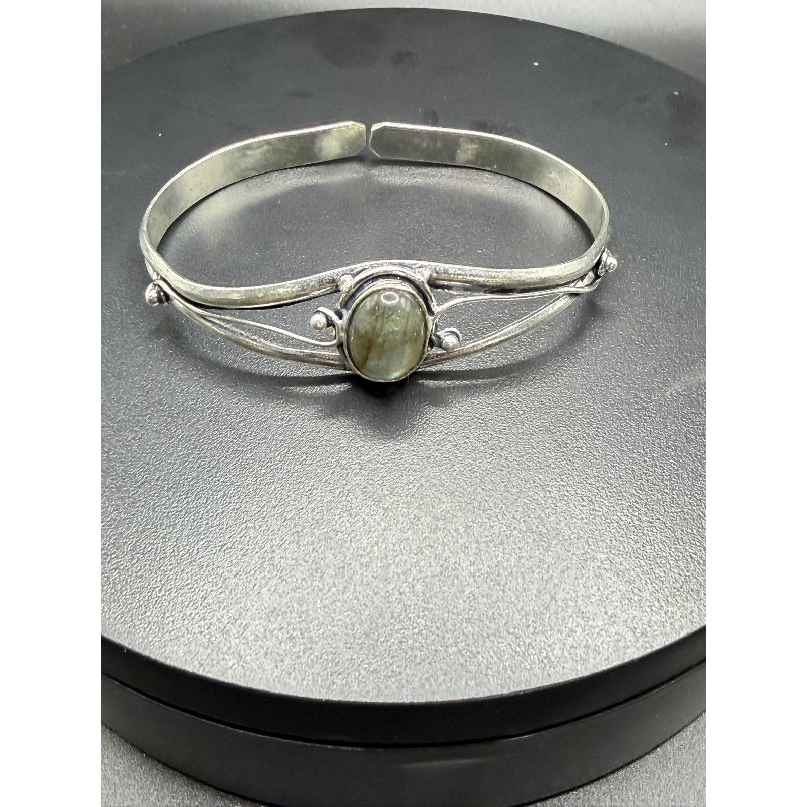 Silver plated bangle gem bracelet with handcrafted design from Republic Mercantile, featuring decorative gemstones and intricate detailing.