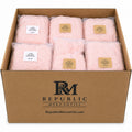 Set of 21 pink and white infant jumpsuits from Republic Mercantile in a wholesale reseller's box, arranged neatly in the image.