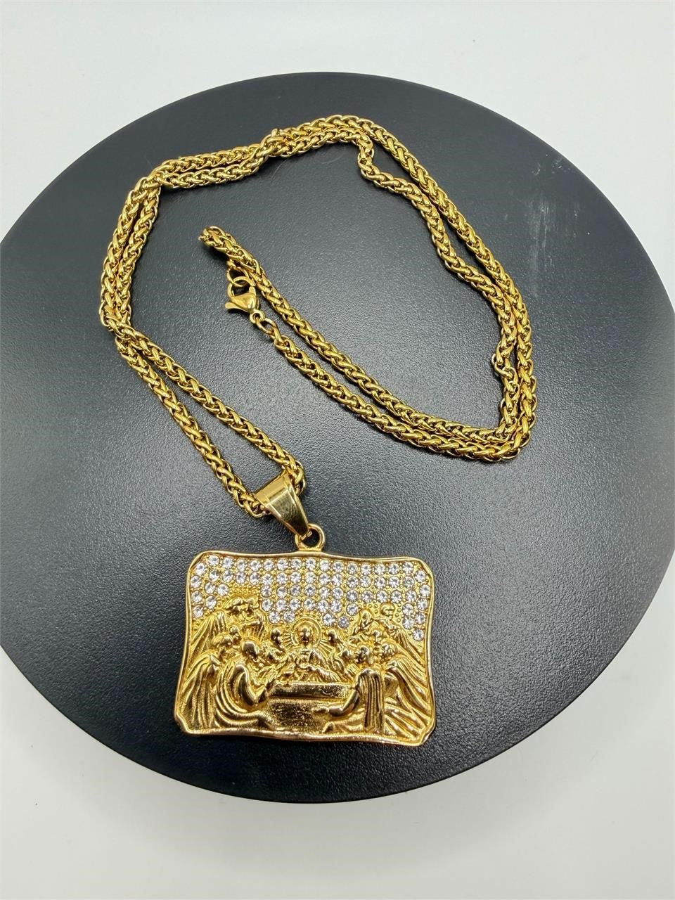 Gold pendant featuring the Last Supper design on a long chain, crafted by Republic Mercantile.