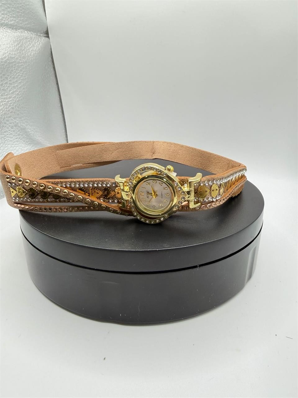 Ladies boho bejeweled wrap watch by Republic Mercantile featuring a stylish, bejeweled strap and elegant watch face.
