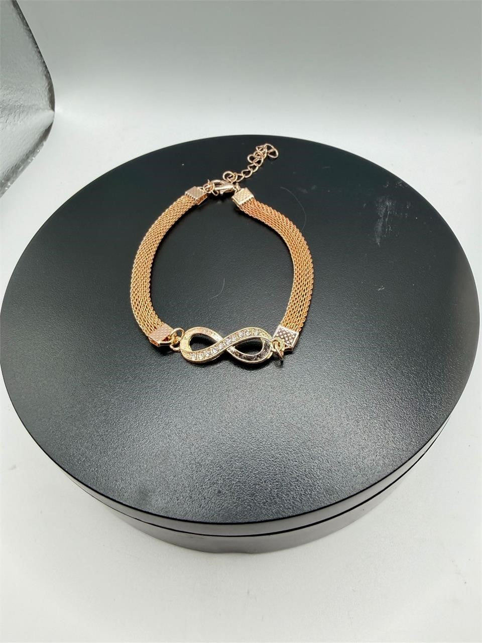 Rose gold figure 8 fashion jewelry bracelet with delicate chain and clasp, stylish accessory by Republic Mercantile.