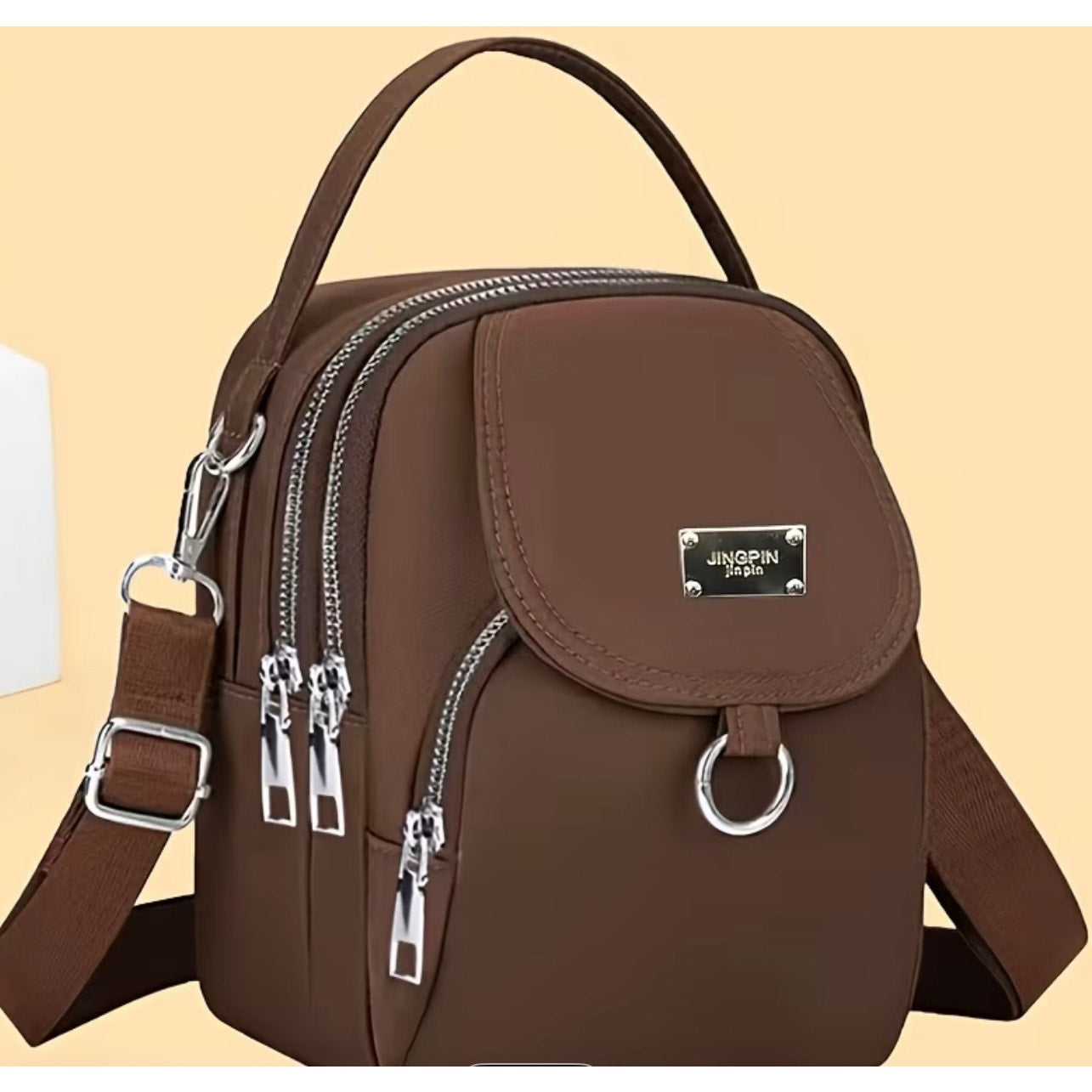 Women's single shoulder bag by Jingpin with multiple pockets and zippered compartments, featuring a stylish multi-pocket design.