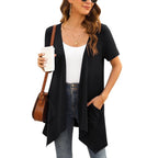 Wholesale box of 33 cardigans and sweaters from Republic Mercantile, showing various styles in the 28.5lb Manifested Resellers lot.