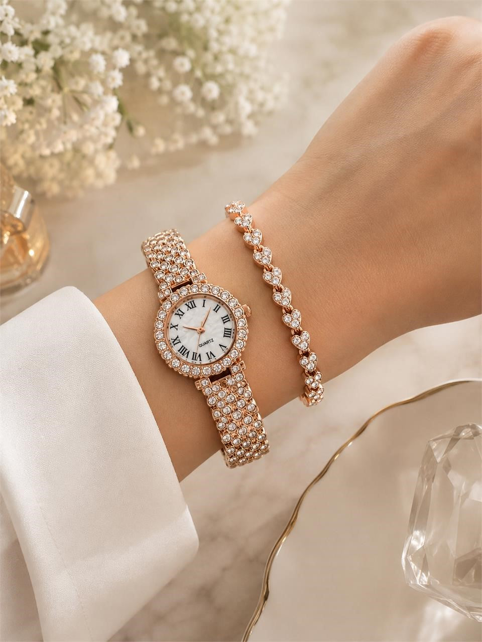 Rose gold ladies 2-piece watch and bracelet set with cubic zirconia, featuring elegant design and stylish accessories.