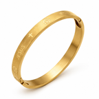 Golden stainless steel Christian bracelet for women, featuring religious symbols, from Republic Mercantile.