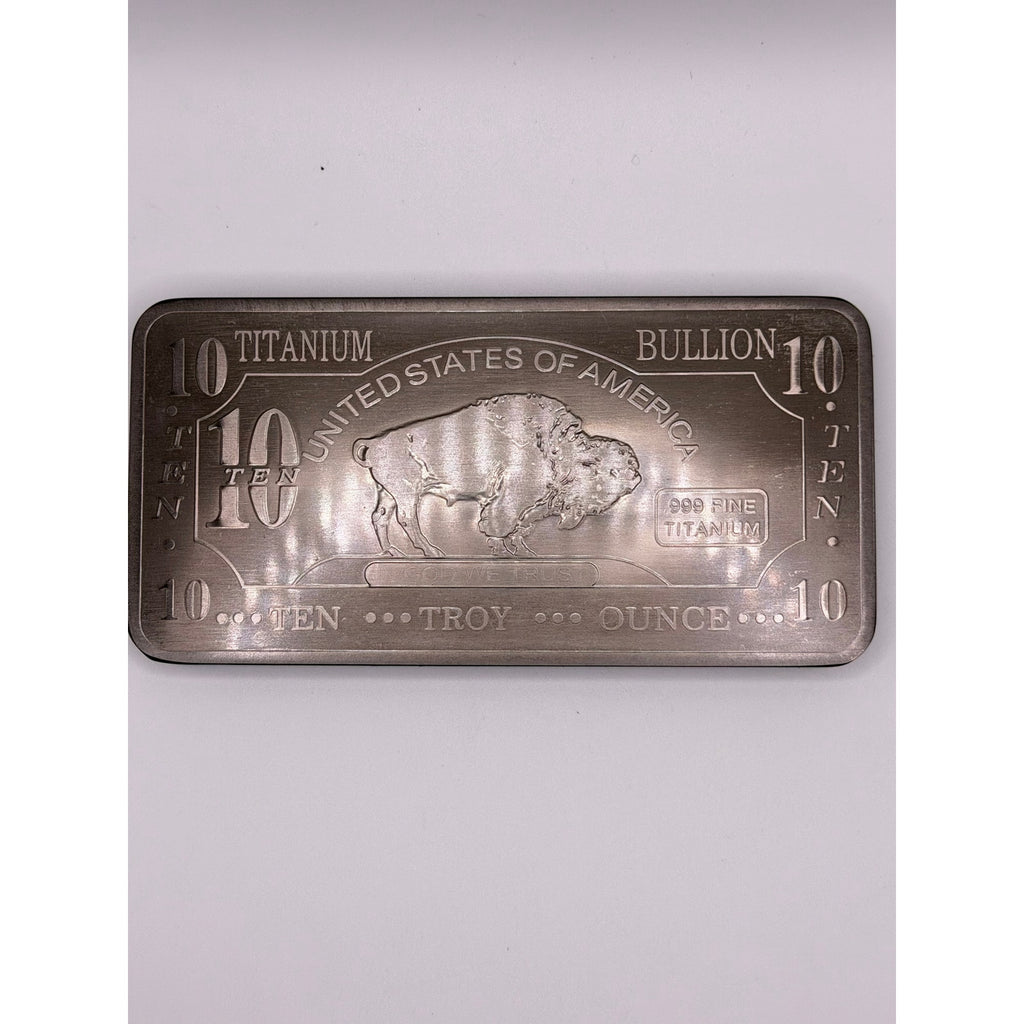 Ten Troy oz CMC Mint .999 fine titanium collectible bar with engraved details and serial number on a reflective surface.